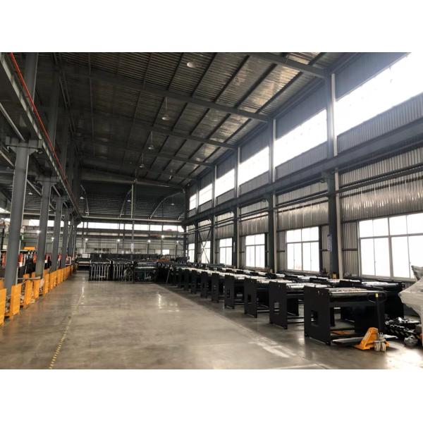 Film lamination machine installed in professional workshop setting