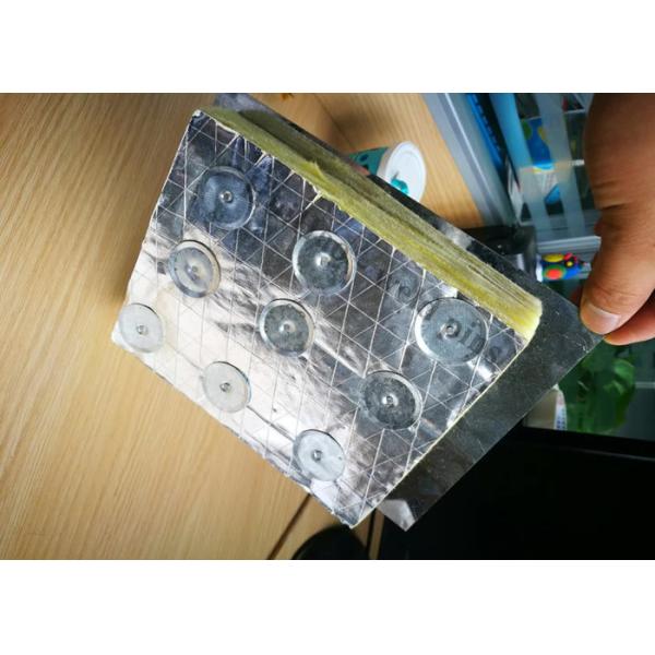 Close-up of duct liner pin installation