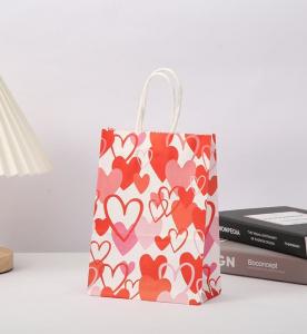 China Red 80gsm Kraft Paper Gift Bags Love Heart Printed Paper Goodie Bags With Handles on sale