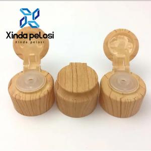 China 28mm Flip Top Plastic Bottle Caps Cosmetic Packaging Natural Bamboo Bottle Container Head on sale