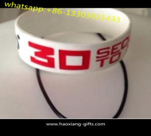 China customized debossed logo lover luminous white silicone wristbands/bracelet on sale