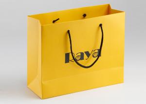 China Yellow Matte Paper Shopping Bags Nylon Handle And Customized Logo Printed on sale