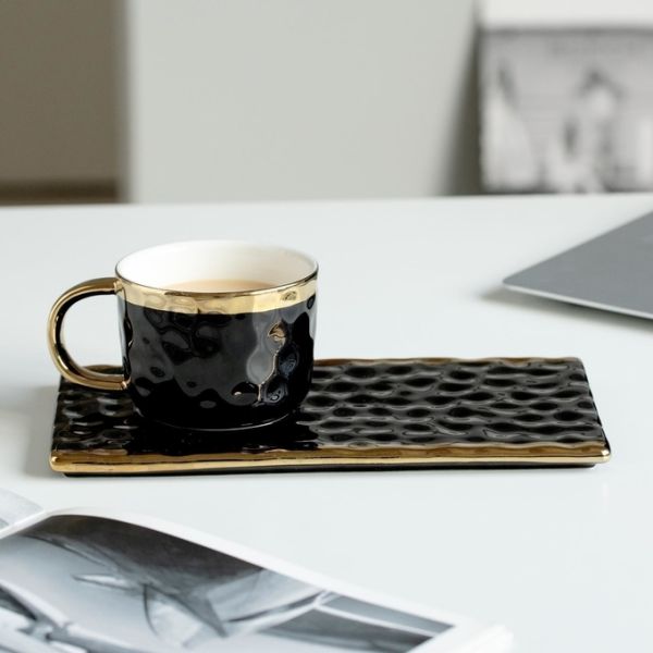 Elegant Black Ceramic Mugs With Gold Accents Wavy Textures For Coffee Tea Pastry Pairings Modern Minimalist Design